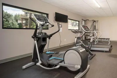 a gym with two exercise bikes in a room at Hi Country Haus Unit 2111 in Winter Park