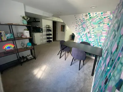 a room with a table and two chairs and a wall at Artsy Platt Park Apartment Guest Suite for 4, QUICK Mountain Access! in Denver
