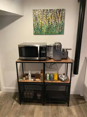 a microwave oven on a shelf with food at Artsy Platt Park Apartment Guest Suite for 4, QUICK Mountain Access! in Denver