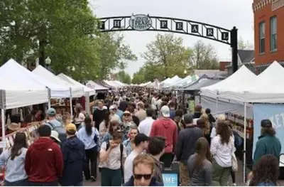 a crowd of people walking through a market with tents at Artsy Platt Park Apartment Guest Suite for 4, QUICK Mountain Access! in Denver
