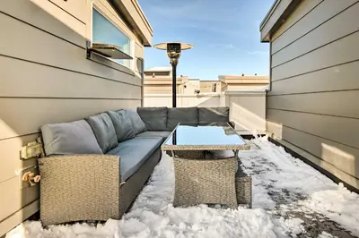 a couch and a table on the side of a building at Modern Townhome Rental 1 Mi to Downtown Denver! in Denver