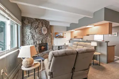 a living room with a couch and a fireplace at Lake View Condo: Walk To Downtown/Lake Dillon in Dillon