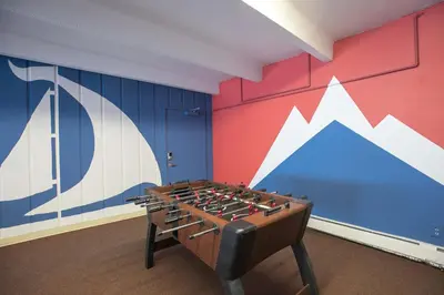 a ping pong table in a room with a wall at Lake View Condo: Walk To Downtown/Lake Dillon in Dillon