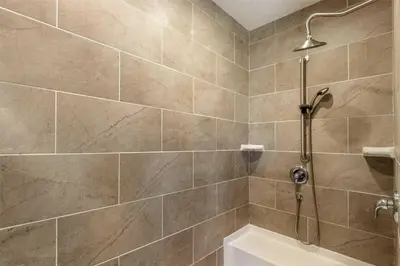a shower stall in a bathroom with a tub at Stillwater, 0020 in Grand Lake