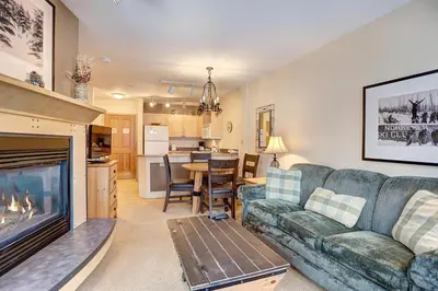 a living room with a couch and a fireplace at Silver Mill 8200 - 1Br-Walk to Slopes! Kids Ski Free! condo in Keystone