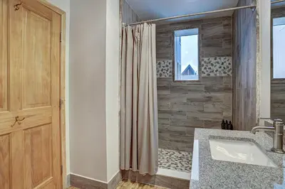 a bathroom with a shower curtain and a sink at Premier Silver Mill 8229 - 2Br-Walk to Slopes! Kids Ski Free! condo in Keystone