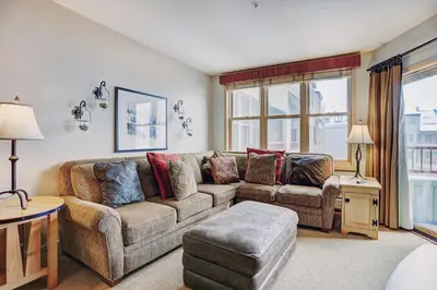 a living room with a couch and a table at Silver Mill 8253 - 1Br-Walk to Slopes! Kids Ski Free! condo in Keystone