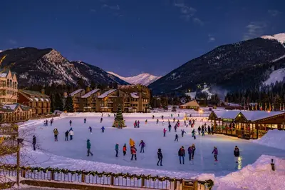 a group of people skating on a rink in the snow at Silver Mill 8253 - 1Br-Walk to Slopes! Kids Ski Free! condo in Keystone