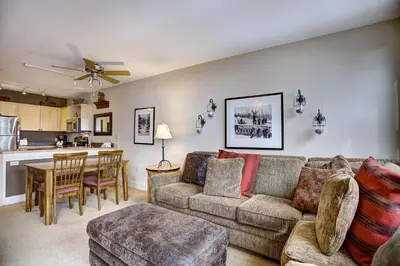 a living room with a couch and a table at Silver Mill 8253 - 1Br-Walk to Slopes! Kids Ski Free! condo in Keystone