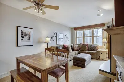 a living room with a couch and a table at Silver Mill 8253 - 1Br-Walk to Slopes! Kids Ski Free! condo in Keystone