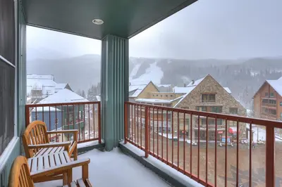 a balcony with a view of the snow covered mountains at Silver Mill 8260 - 2Br-Walk to Slopes! Kids Ski Free! condo in Keystone