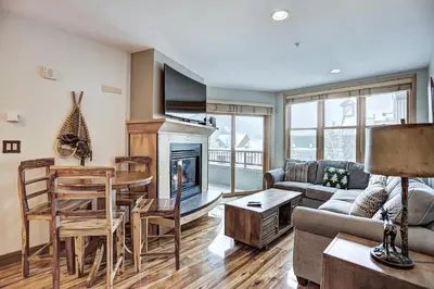 a living room with a couch and a fireplace at Premier Silver Mill 8281 - 2Br-Walk to Slopes! Kids Ski Free! condo in Keystone