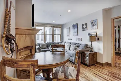 a living room with a couch and a table at Premier Silver Mill 8281 - 2Br-Walk to Slopes! Kids Ski Free! condo in Keystone
