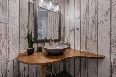 a bathroom with a bowl sink and a mirror at Skyes Peak - Luxury Mountain Retreat with Breathtaking Views in Estes Park