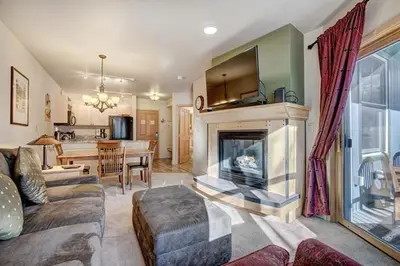 a living room with a couch and a fireplace at Silver Mill 8167 - 1Br-Walk to Slopes! Kids Ski Free! condo in Keystone