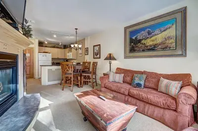a living room with a couch and a table at Silver Mill 8173 - 1Br-Walk to Slopes! Kids Ski Free! condo in Keystone