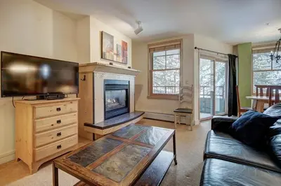 a living room with a couch and a tv at Silver Mill 8184 - 1Br-Walk to Slopes! Kids Ski Free! condo in Keystone