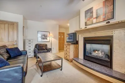 a living room with a fireplace and a couch at Silver Mill 8184 - 1Br-Walk to Slopes! Kids Ski Free! condo in Keystone