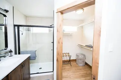 a bathroom with a shower and a sink at Close to RMNP, Estes,& Amenities in Estes Park
