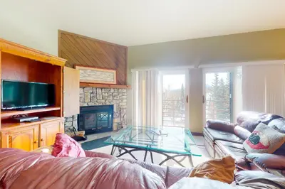 a living room with a couch and a glass table at Buffalo Ridge B107 in Silverthorne