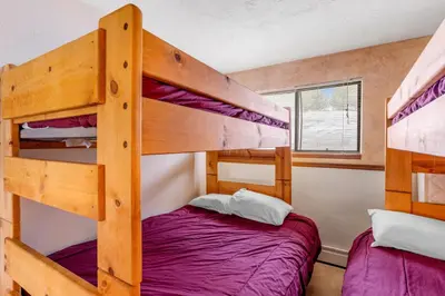 a bunk bed room with two bunk beds in it at Buffalo Ridge B107 in Silverthorne