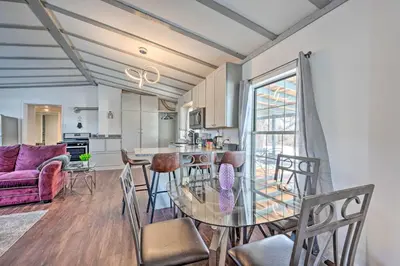 a kitchen and living room with a glass table and chairs at Multi-Unit Denver Vacation Rental Home! in Denver