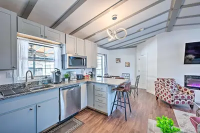 a kitchen with blue cabinets and a counter top at Multi-Unit Denver Vacation Rental Home! in Denver