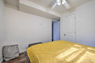 a bedroom with a bed and a ceiling fan at Multi-Unit Denver Vacation Rental Home! in Denver
