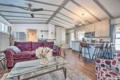 a living room with a purple couch and a table at Multi-Unit Denver Vacation Rental Home! in Denver