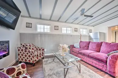 a living room with a purple couch and a table at Multi-Unit Denver Vacation Rental Home! in Denver