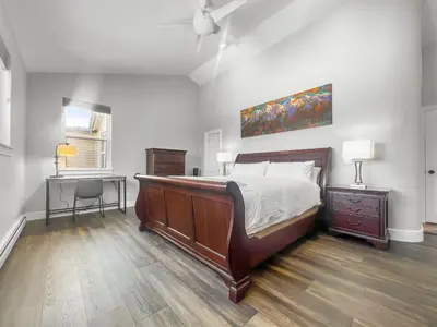 a bedroom with a large bed and a desk at 928A Lakepoint Circle 3Br 2,5Ba home in Frisco