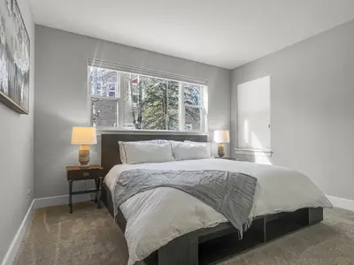 a bedroom with a large bed and a window at 928A Lakepoint Circle 3Br 2,5Ba home in Frisco