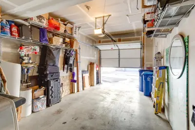a garage with a long hallway with lots of tools at 4 Mi to Airport Convenient Denver Condo in Aurora
