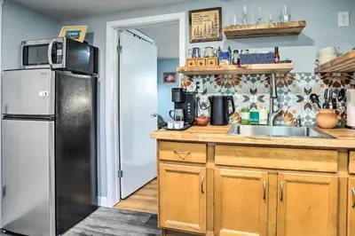 a kitchen with a refrigerator and a sink at 3 Mi to Dtwn Convenient Denver Apt in Denver