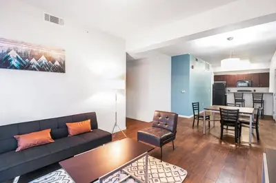 a living room with a couch and a table at Fully Furnished 2BR Centrally Located with Pool in Greeley