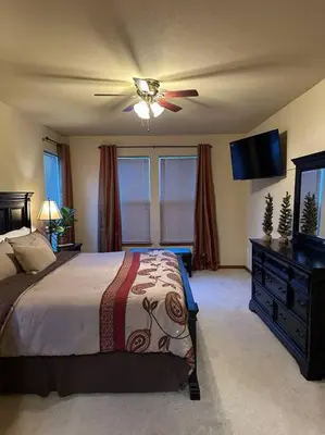 a bedroom with a bed and a ceiling fan at Granby Ranch Ski & Golf Getaway - Pank's Peak in Granby