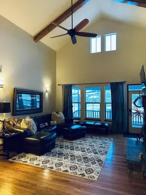 a living room with a couch and a ceiling fan at Granby Ranch Ski & Golf Getaway - Pank's Peak in Granby