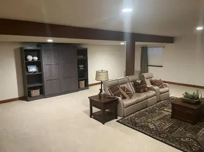 a living room with a couch and a table at Granby Ranch Ski & Golf Getaway - Pank's Peak in Granby