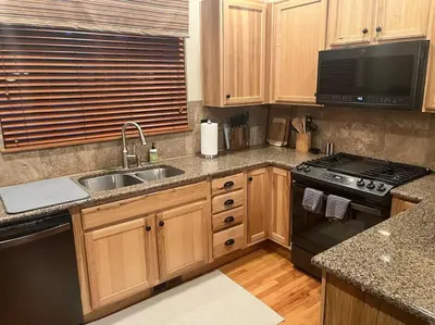 a kitchen with a sink and a stove at Granby Ranch Ski & Golf Getaway - Pank's Peak in Granby