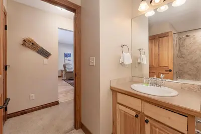a bathroom with a sink and a mirror at Telemark Townhomes Unit 514 in Winter Park