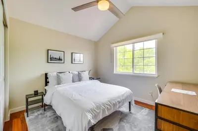 a bedroom with a white bed and a window at 13 Mi to Dtwn Denver Arvada Townhome with Deck in Arvada