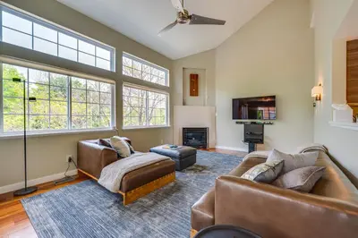 a living room with two couches and a tv at 13 Mi to Dtwn Denver Arvada Townhome with Deck in Arvada