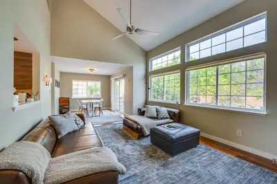 a living room with a couch and a table at 13 Mi to Dtwn Denver Arvada Townhome with Deck in Arvada