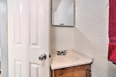 a bathroom with a sink and a mirror at Vacation Rental Near Boyd Lake, Colorado! in Loveland