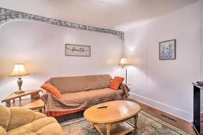 a living room with a couch and a table at Pet-Friendly Loveland Vacation Rental! in Loveland