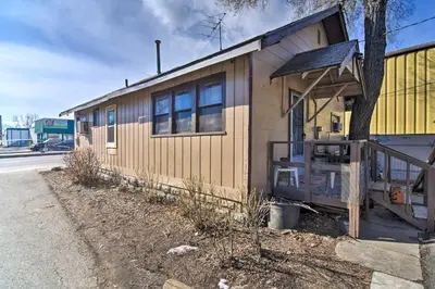 a small house is sitting on the side of a road at Pet-Friendly Loveland Vacation Rental! in Loveland