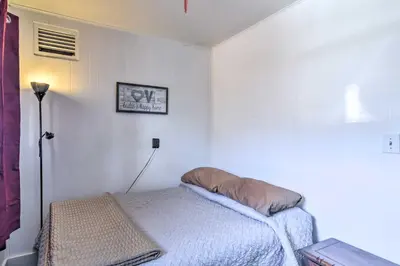 a bedroom with a bed with a pillow on it at Pet-Friendly Loveland Vacation Rental! in Loveland