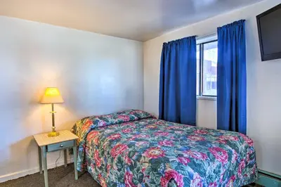 a small bedroom with a bed and a window at Vacation Rental in Loveland 1 Mi to Downtown! in Loveland