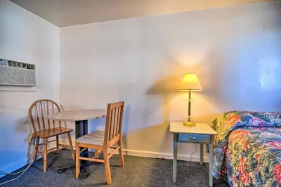 a room with a bed and a table and chairs at Vacation Rental in Loveland 1 Mi to Downtown! in Loveland