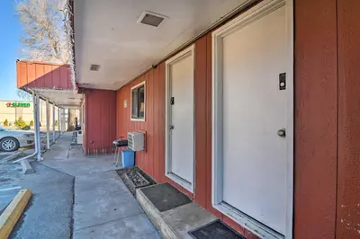 a red building with a white door on the side of it at Vacation Rental in Loveland 1 Mi to Downtown! in Loveland